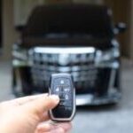 car key in front of an suv